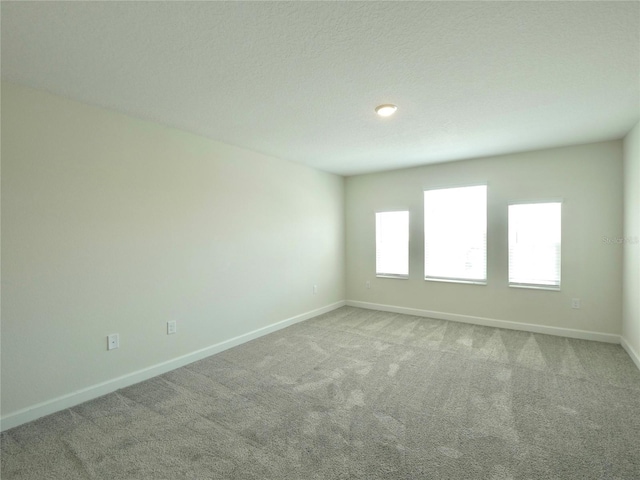 unfurnished room featuring carpet flooring