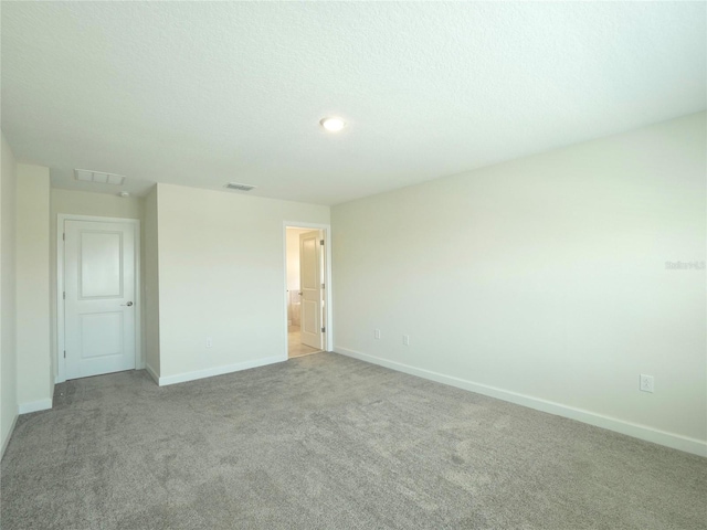 unfurnished bedroom with light carpet