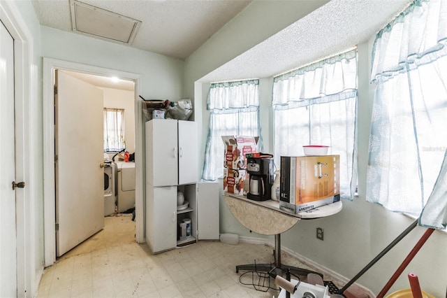 interior space featuring separate washer and dryer and a wealth of natural light