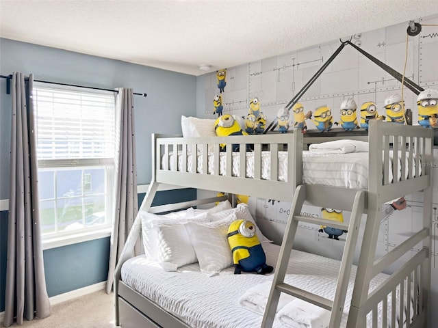 carpeted bedroom with a textured ceiling