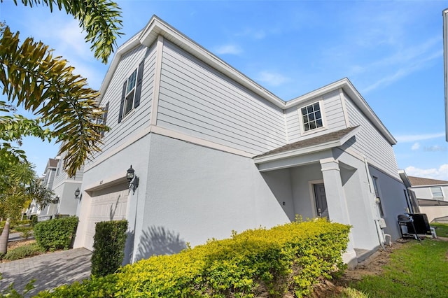 view of side of property with a garage