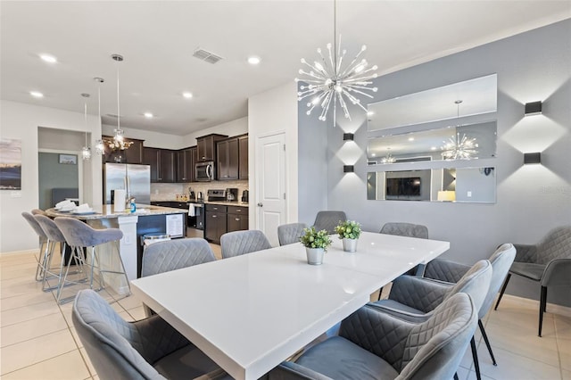 tiled dining area with a notable chandelier