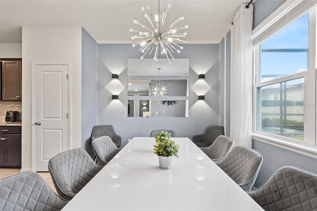 dining area with a wealth of natural light and an inviting chandelier