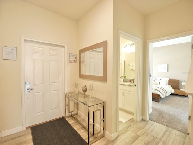 view of carpeted foyer entrance