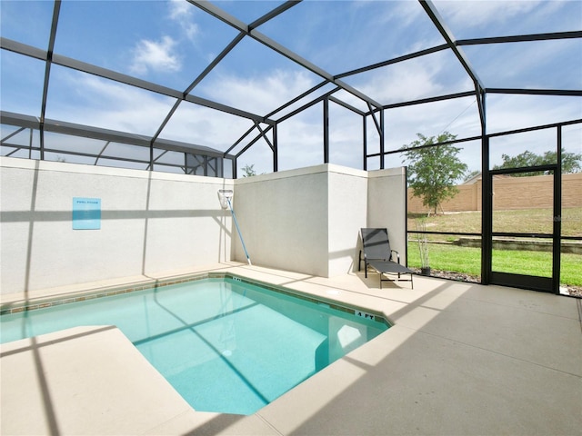 view of pool with a lanai and a patio