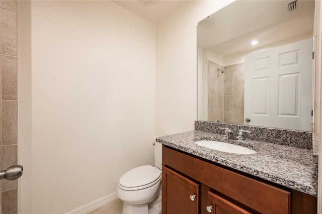 bathroom with tile patterned floors, vanity, and toilet