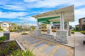 view of home's community with a patio area