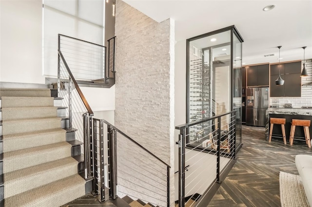 stairs with parquet flooring