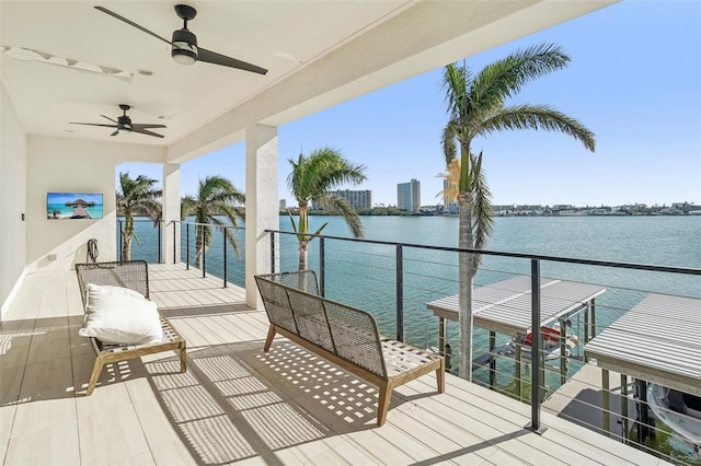 deck featuring a water view and ceiling fan