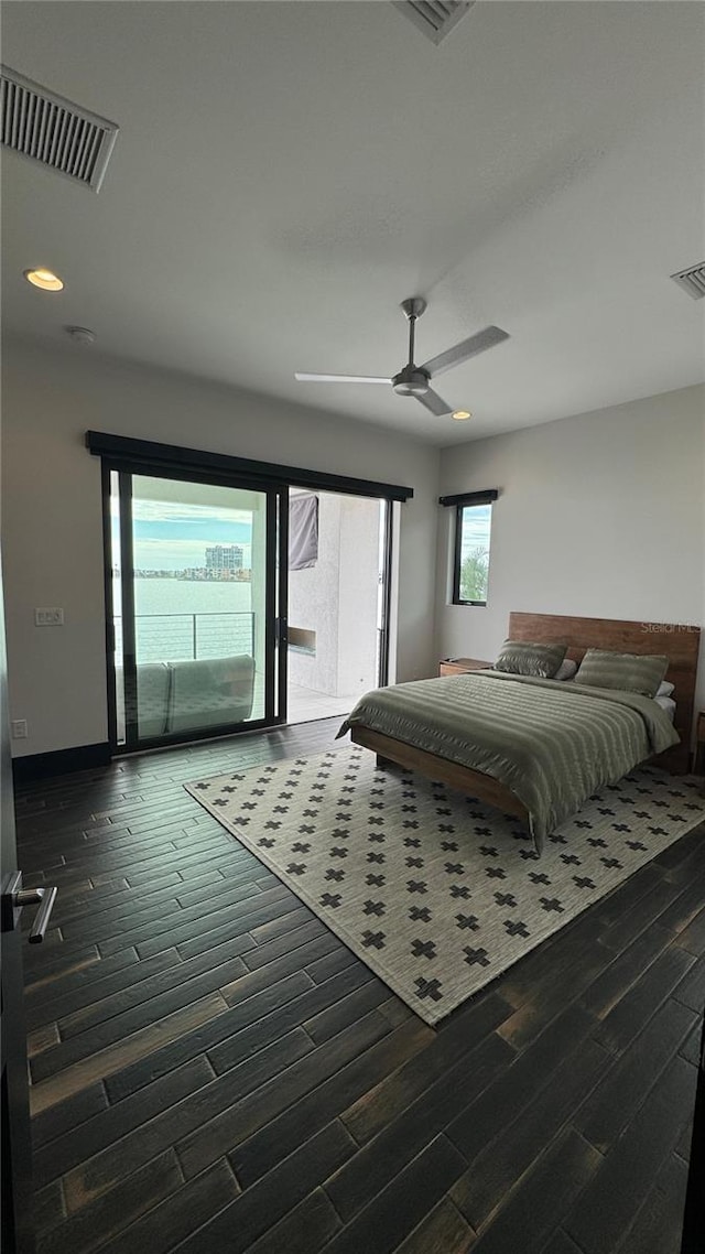 bedroom featuring access to exterior, ceiling fan, and dark wood-type flooring