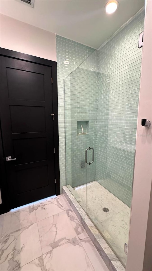 bathroom with an enclosed shower