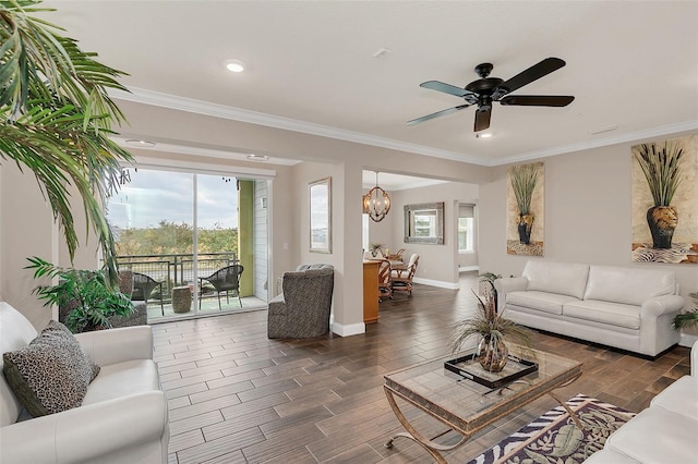 living room featuring ceiling fan with notable chandelier and ornamental molding