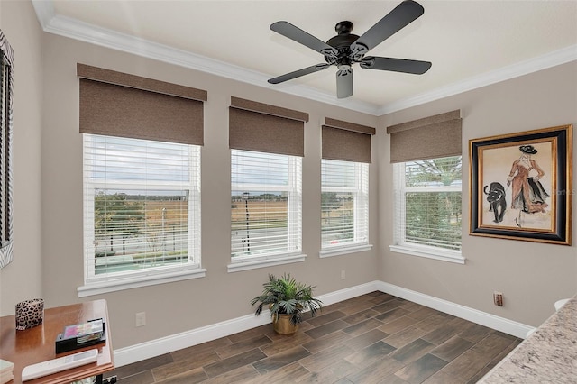 living area with a wealth of natural light, ornamental molding, and ceiling fan