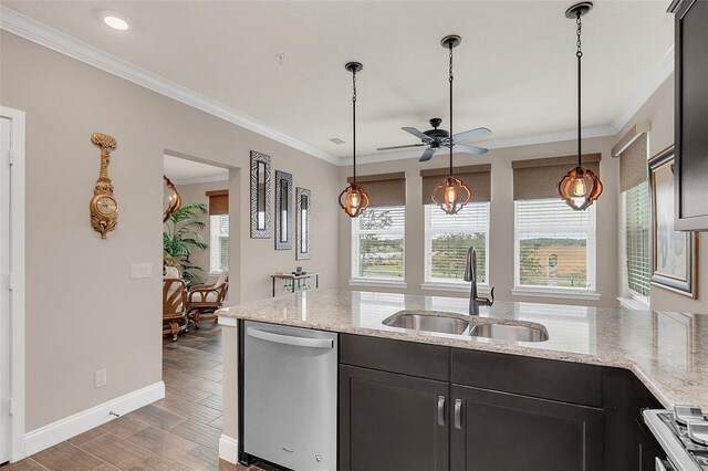 kitchen with ceiling fan, sink, light stone counters, stainless steel dishwasher, and crown molding