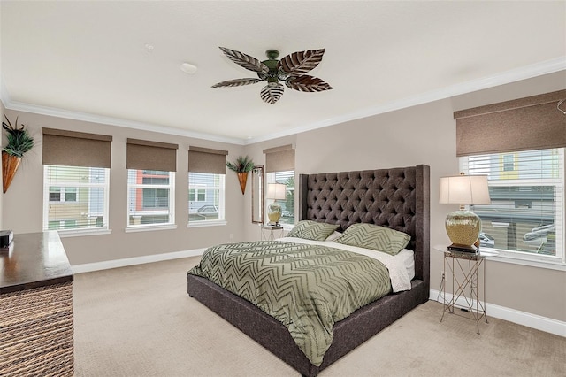 bedroom with carpet, ceiling fan, and ornamental molding