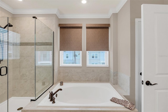 bathroom featuring separate shower and tub and crown molding