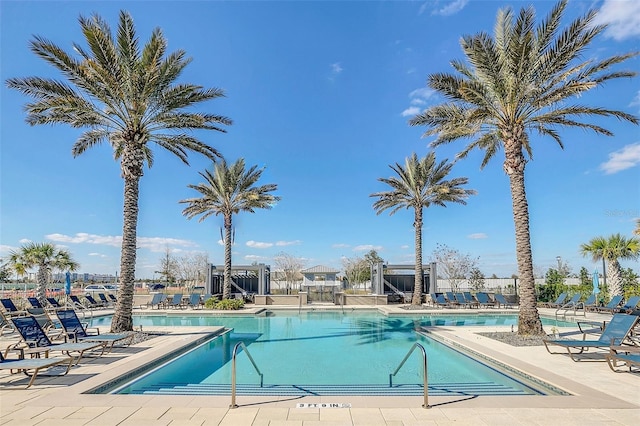 view of swimming pool with a patio