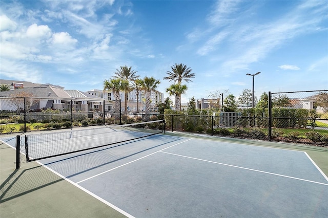 view of tennis court featuring basketball court