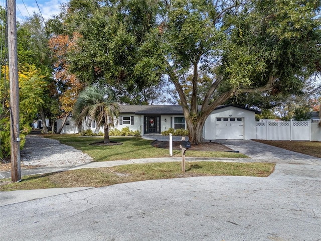 view of front facade featuring a front lawn and a garage