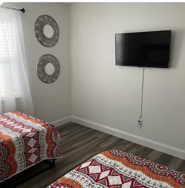 bedroom featuring dark hardwood / wood-style floors