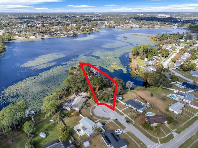 birds eye view of property with a water view