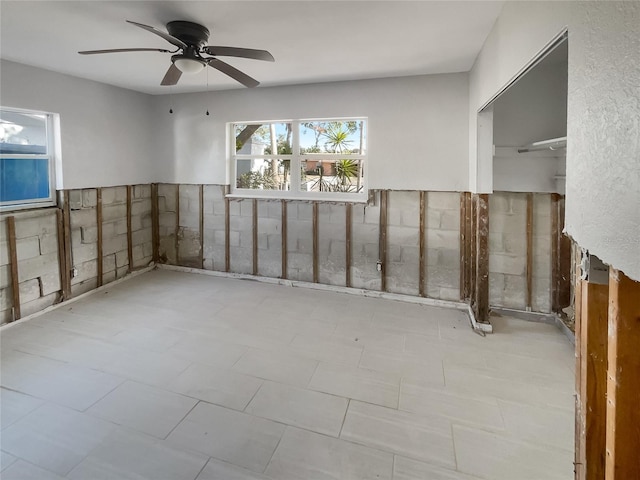 interior space featuring ceiling fan