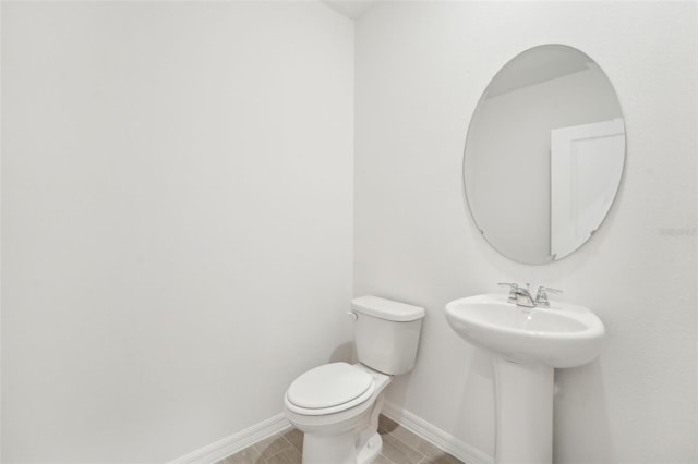 bathroom with sink and toilet