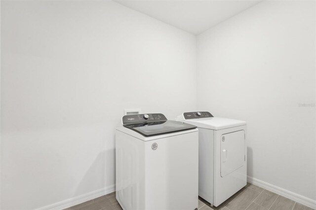 laundry room with washing machine and dryer