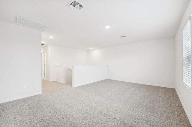 spare room with light colored carpet