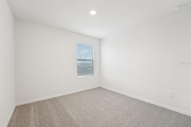 spare room with carpet flooring