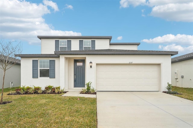 view of front of property featuring a garage and a front yard