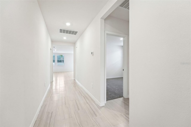 hall with light hardwood / wood-style floors