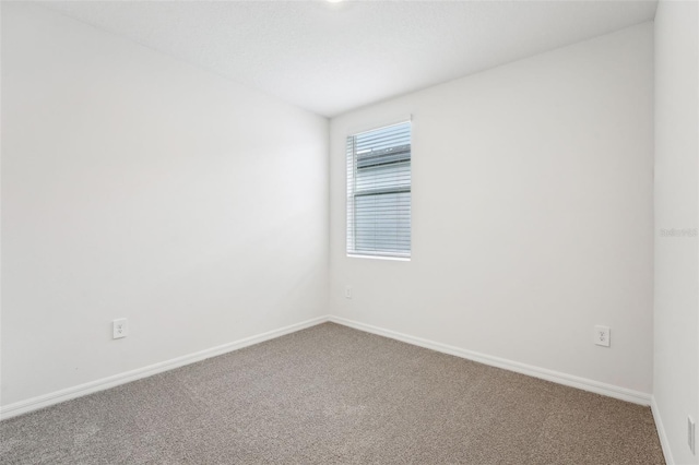 unfurnished room with carpet floors