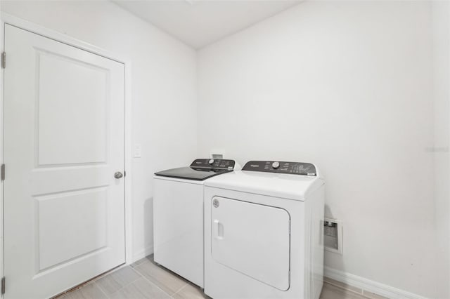 laundry area with washing machine and dryer