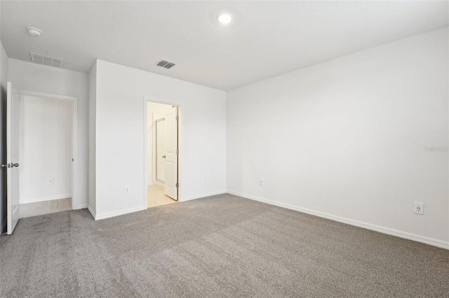 empty room with light colored carpet