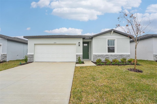 view of front of property featuring a garage and a front yard