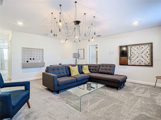 carpeted living room featuring an inviting chandelier