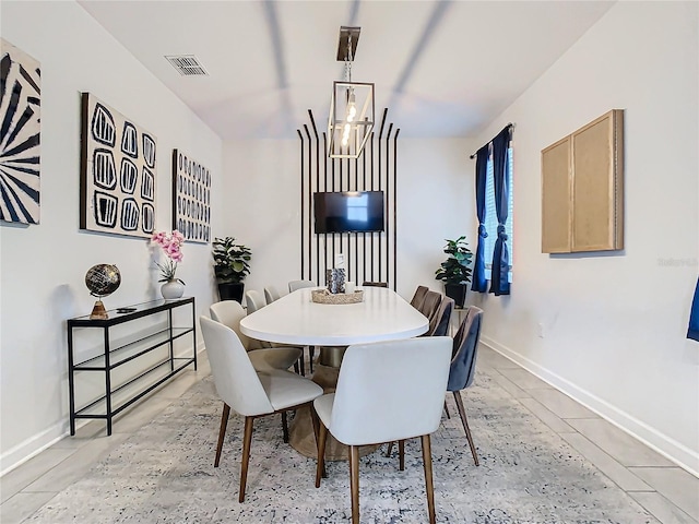 dining room with a chandelier