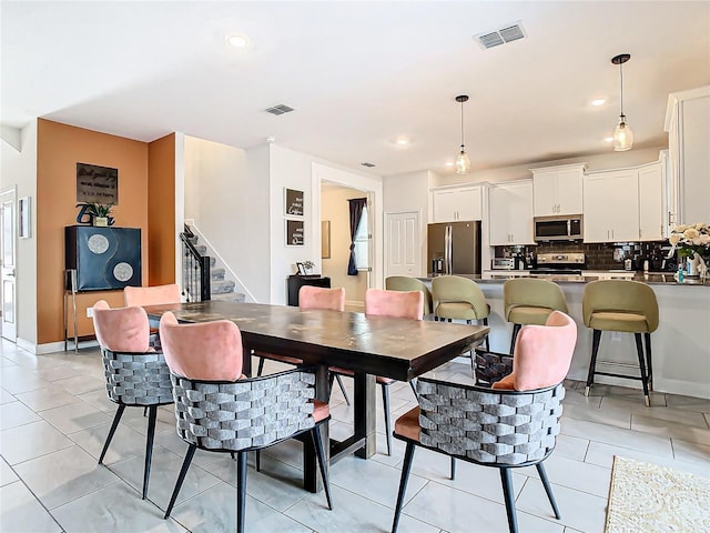 dining room with light tile patterned flooring