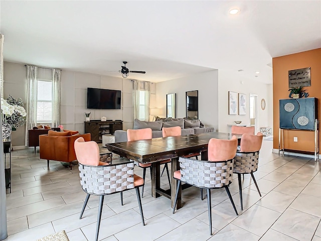 dining area featuring ceiling fan and light tile patterned floors