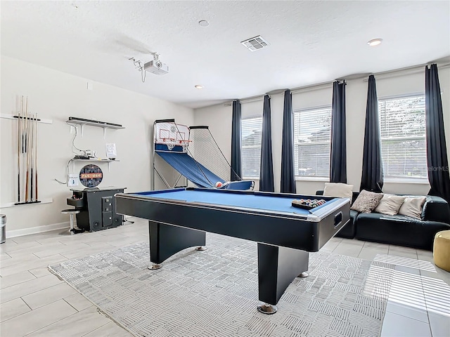 playroom with billiards, light tile patterned flooring, and a textured ceiling