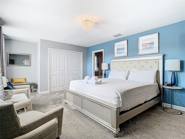 carpeted bedroom with a closet