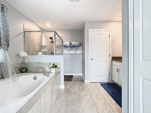 bathroom with vanity, tile patterned flooring, and independent shower and bath