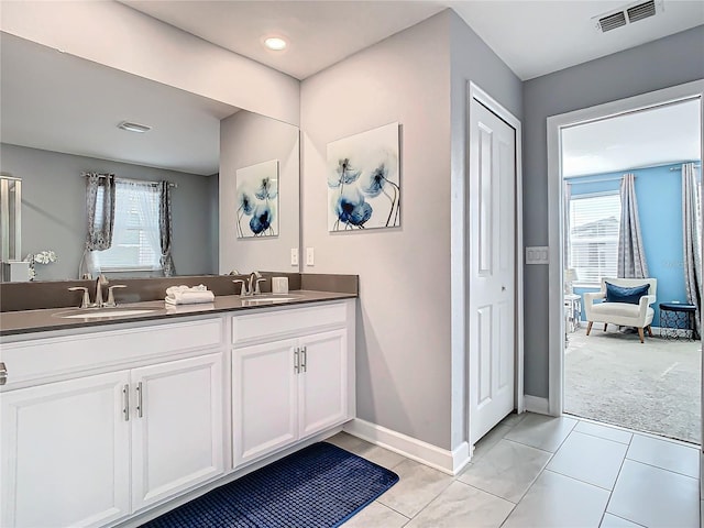 bathroom with vanity and tile patterned flooring