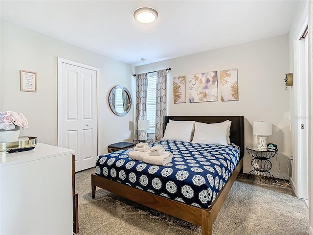 carpeted bedroom featuring a closet