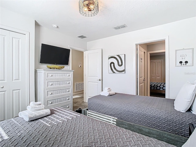 carpeted bedroom featuring a closet