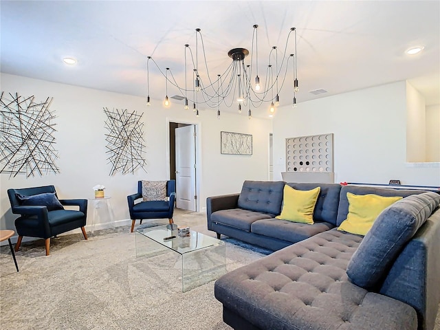 living room featuring carpet floors and a chandelier