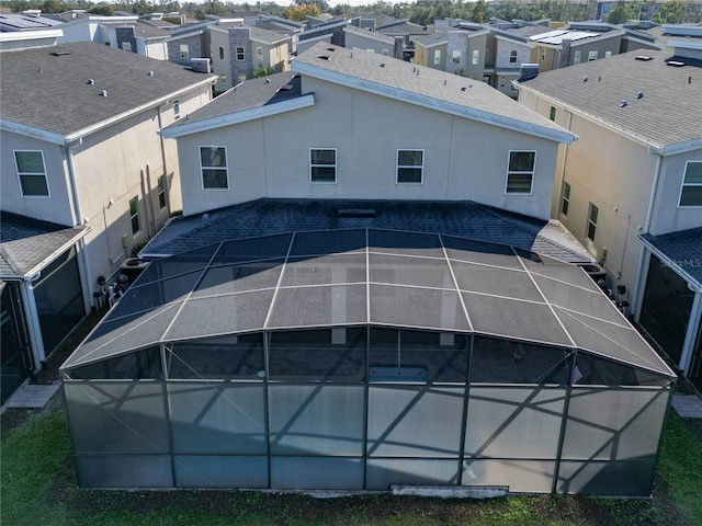 back of house with a lanai