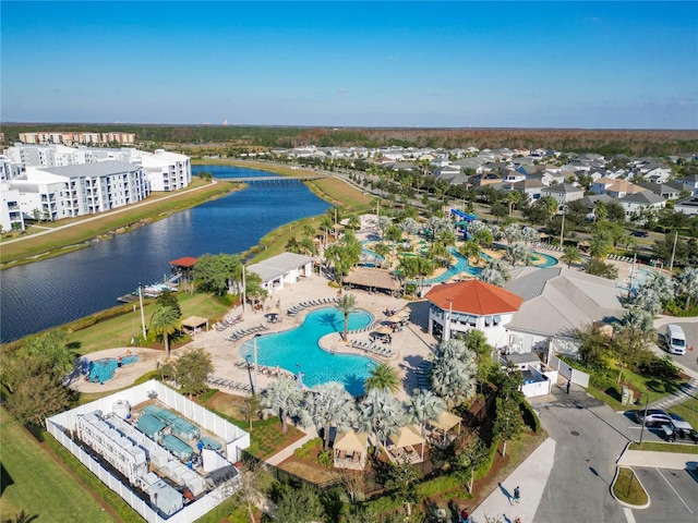 birds eye view of property with a water view