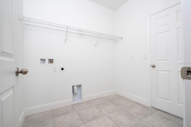 clothes washing area featuring hookup for a washing machine, light tile patterned floors, and electric dryer hookup